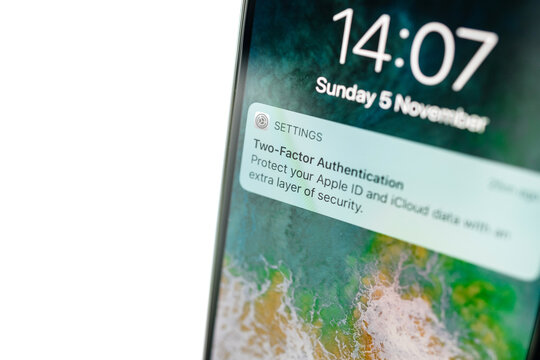 PARIS, FRANCE - NOV 5, 2017: Two-factor authentication on the latest iphone X XS by Apple computers message on the screen - security and privacy of the information data in the telephone