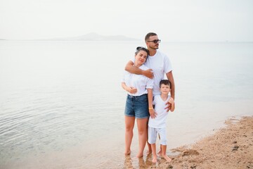 Cute happy family having fun on luxury tropical resort, mother with child, summer holidays, love concept