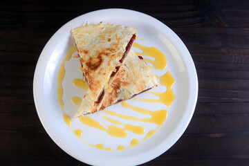 delicious mexican food tacos, guacamole, quesadillas, chilli, tortilla, burritos isolated on black background.