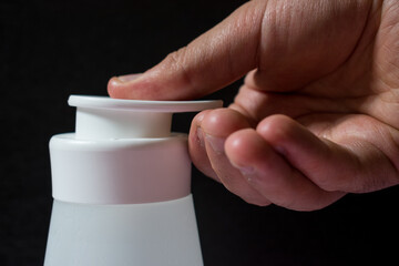 Closeup of a hand using alcohol gel as a sanitizer