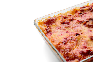 Baking dish with tasty vegetable lasagna on white background, closeup