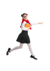 Jumping little schoolgirl with notebooks on white background
