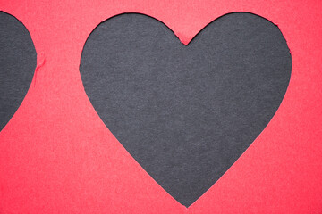 black heart or red paper heart cut out