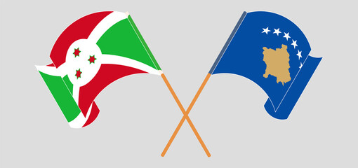 Crossed and waving flags of Burundi and Kosovo