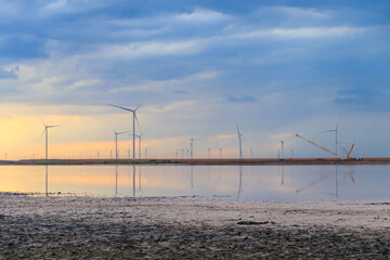 Building and assembling a construction wind turbines farm by a crane