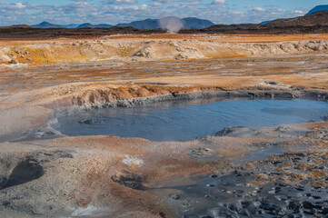 Hverir, a geothermal spot with bubbling pools of mud and steaming fumaroles in Iceland
