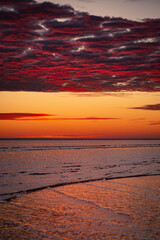 Sunrise over the horizon over the sea at the beach in Darwin, Northern Territory, Australia