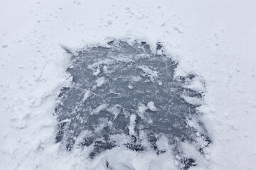 the surface of the lake frozen in ice