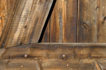 Beautiful old and weathered wood planks on an old barn door