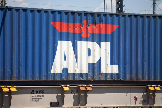 LJUBLJANA, SLOVENIA - JUNE 16, 2021: Logo of APL Containers on a container on freight train. Americain President Lines, or APL is a Singapoe container shipping and cargo transportation carrier company