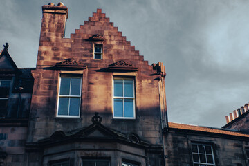 Edinburgh Old Town area of centuries-old buildings and narrow alleys. The Royal Mile, a steep street lined with traditional pubs, casual eateries, souvenir shops and small museums. 