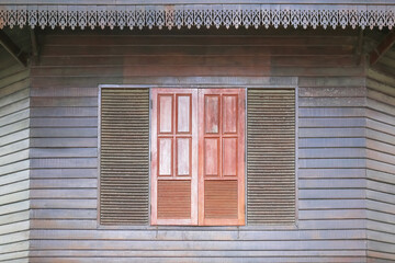 Old wooden window in vintage and antique style for building and decoration a house in the countryside of Thailand.