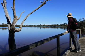 Naklejka premium Australian woman looking at the Swan river Perth Western Austral