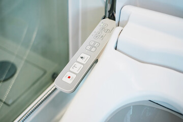 Japan toilet bowl. close up of electronic control panel of toilet sanitary ware with automatic flush system.