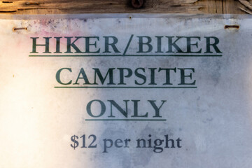 sign that shows a campground is for hikers and bikers