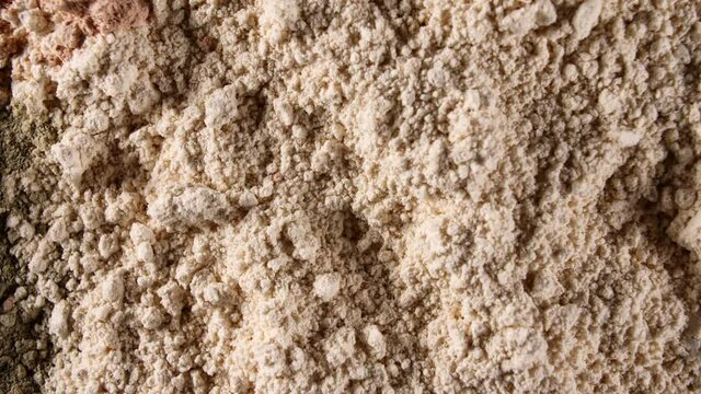Motion of the Dry Mask made of Clay Powder, Cosmetic Texture with Rotation. Contouring, Make up smears background. Macro Shot. Top view. 4K . High quality 4k footage