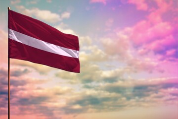 Fluttering Latvia flag mockup with the space for your content on colorful cloudy sky background. - obrazy, fototapety, plakaty