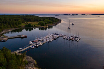 Boat arriving to a guest harbor dusk