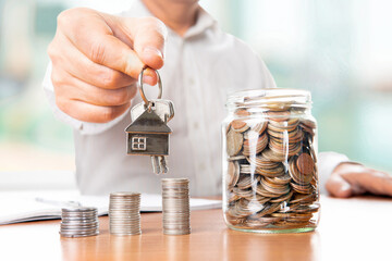 The coins are stored in a glass jar to accumulate finances.