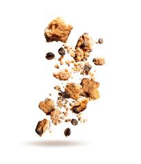 Fly crumbs of oatmeal cookies. Cookie crumbs with chocolate pieces isolated on white background. Crumbs of oatmeal cookies closeup.