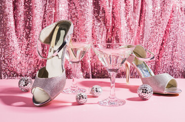 Martini cocktail on the background of a pink shiny curtain. The concept of a holiday, party,...