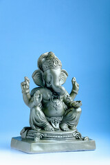 lord ganesha sclupture over blue background. celebrate lord ganesha festival.
