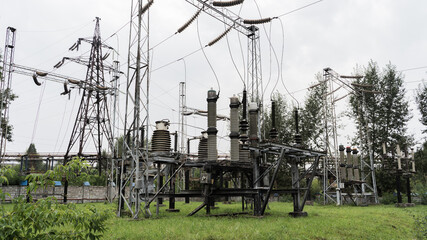 Fototapeta na wymiar Powerful power transmission station. Transformer. Electricity supply.