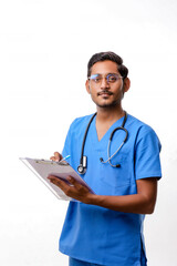 Young indian male doctor dressed in uniform with stethoscope tak