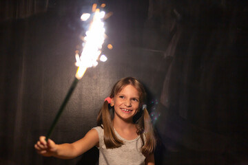 Little girl holding a sparkler