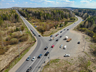 Aerial view of an intersection on a suburban highway in spring (Kirov, Russia)