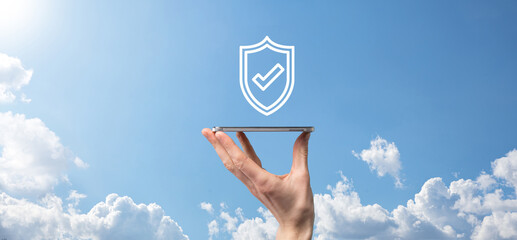 Protection network security computer in the hands of a businessman. business, technology, cyber security and internet concept - businessman pressing shield button on virtual screens Data protection