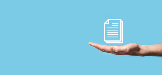 Male hand holding a document icon on blue background. Document Management Data System Business Internet Technology Concept. Corporate data management system DMS