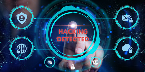 Obraz premium Cyber security data protection business technology privacy concept. Young businessman select the icon Hacking detected on the virtual display.
