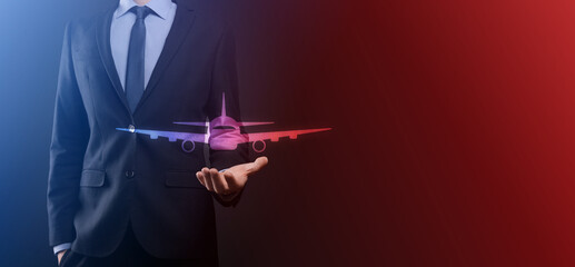 Businessman man holding an plane airplane icon in his hands. Online ticket purchase.Travel icons about travel planning, transportation, hotel, flight and passport.Flight ticket booking concept