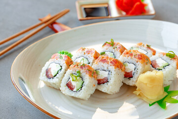 Japanese sushi roll with salmon on plate