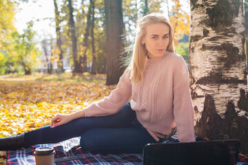 Young woman working with laptop outdoors