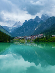 Fototapeta premium Dolomite mountains reflecting in the Mizurina lake, Italy
