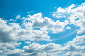 Naklejka na ściany i meble Blue sky and fluffy white clouds- Stock Photo. 