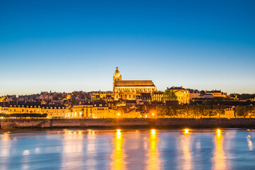 Cityscape of Blois with Cathedral over Loire river France at dusk