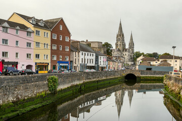 View of Cork Cathedral in Ireland on the banks of the river with the reflection in the river water