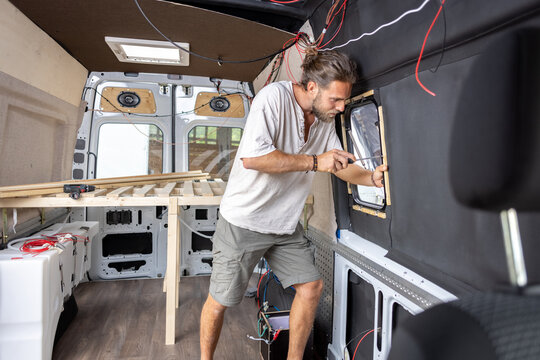 Man working on the interior of his camper van