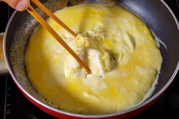 Cooking Tornado Omelette is a Korean dish. selective focus