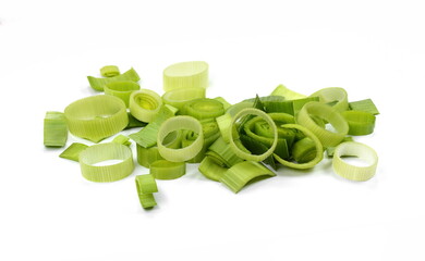 Natural fresh cutted leeks isolated on white background. Closeup of sliced leek. Slices of the fresh green leek. Chopped Leek. Fresh vegetables.