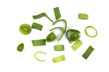 Natural fresh cutted leeks isolated on white background. Closeup of sliced leek. Slices of the...