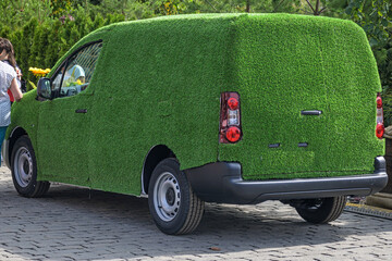 The light truck is decorated with artificial turf