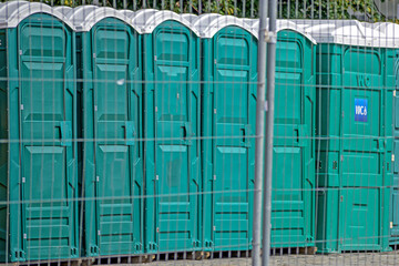 Mobile public toilets on the city square on a summer day