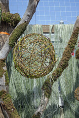 Decorative ball made of willow twigs on a summer day