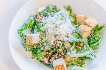 Caesar salad in white plate