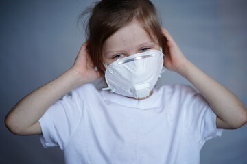 Headache, coronavirus in a child, a girl in a mask was vaccinated at the hospital