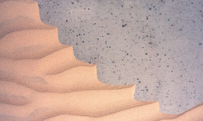 Sand textures background on the beach on a grey basis